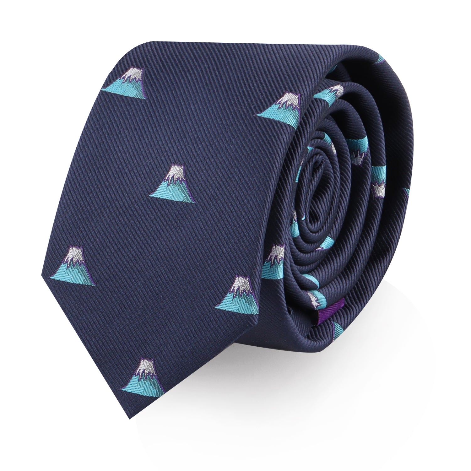 A rolled-up Mountain Skinny Tie, navy blue with a repeated pattern of small teal and white mountain-like designs, capturing the beauty of nature and the essence of style.