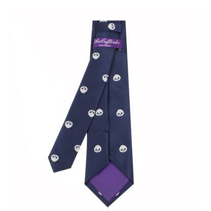 A dark blue **Panda Skinny Tie** with small panda faces pattern, exuding a playful charm, featuring a purple fabric patch on the underside and a purple tag reading "Australian" in white text.