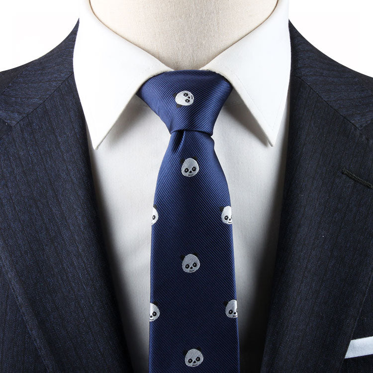 A close-up of a person wearing a Panda Skinny Tie, a white dress shirt, and a dark pinstriped suit jacket exuding modern sophistication with a touch of playful charm.