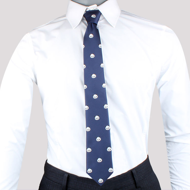 A person wearing a white dress shirt, a Panda Skinny Tie with small white skull patterns that add playful charm, and dark trousers exudes modern sophistication.