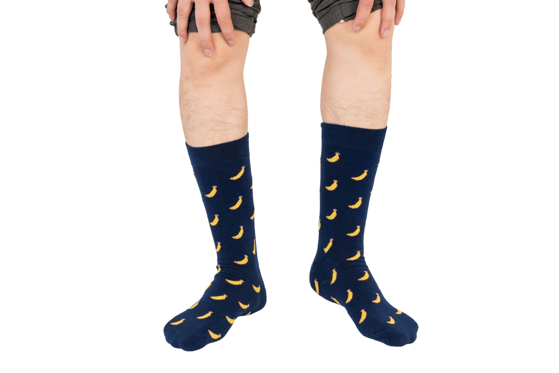 A boy wearing a pair of Banana Socks.
