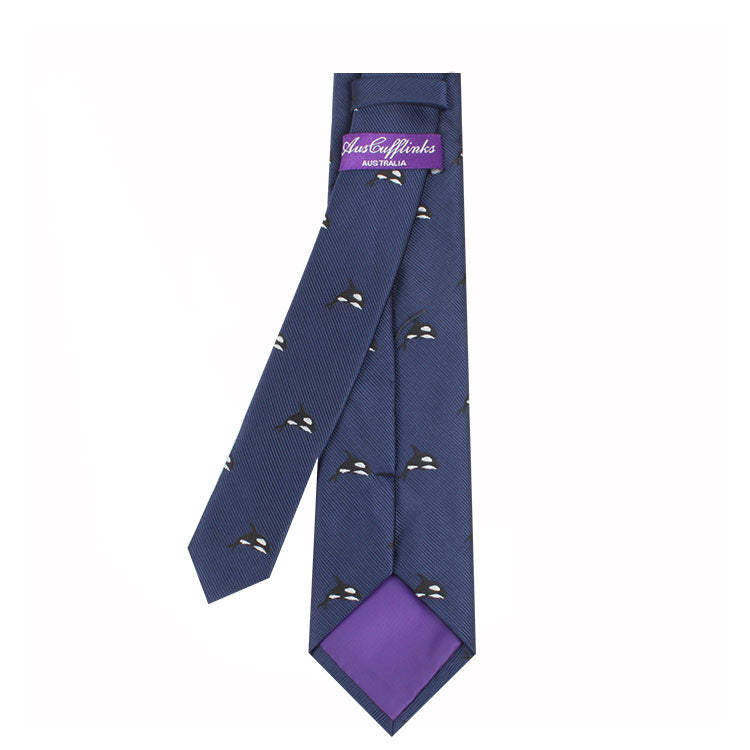 Killer Whale Skinny Tie with small black and white bird designs and purple lining, exuding contemporary elegance. It features a purple label with white text reading "Master Plans," adding an extra touch of allure.