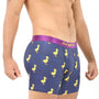 A man wearing Duck Underwear—navy blue boxer briefs adorned with a cheerful yellow duck pattern and featuring a vibrant pink waistband—stands against a white background, exuding plush comfort.