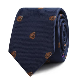 This Grizzly Bear Skinny Tie in dark blue showcases brown embroidered grizzly bear heads, emanating a subtle sophistication and untamed allure.