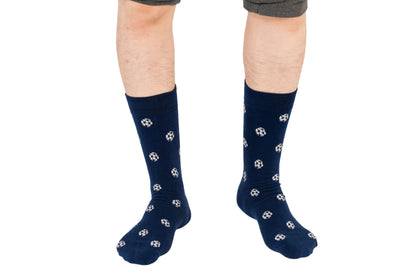 Person wearing Soccer Socks, standing on a white background, showcasing goal-worthy comfort with every step.