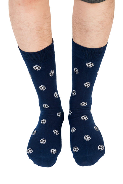 Close-up of a person's legs wearing blue socks with a pattern of small white flowers, ensuring goal-worthy comfort with every step in Soccer Socks.