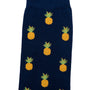 A Pineapple Sock featuring a pattern of yellow pineapples with green leaves, designed for tropical comfort from heel to toe.