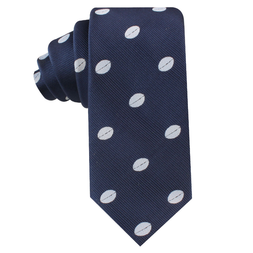Rugby Skinny Tie with a style of white polka dots, rolled and displayed against a white background.