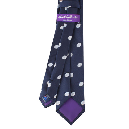 A Rugby Skinny Tie with white polka dots, featuring a purple tail and a label reading "justcufflinks australia," exudes rugged athleticism.