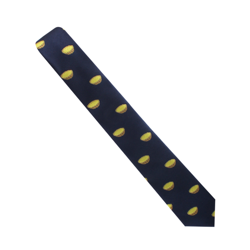 Introducing the Egg Tart Skinny Tie in dark blue, adorned with a stylish pattern of yellow tennis balls evenly distributed across the fabric.