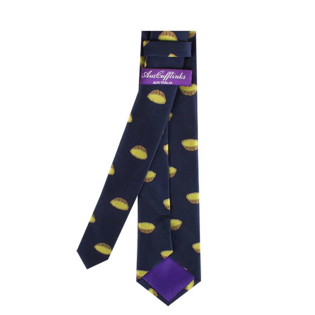 A necktie in navy blue with a delightful pattern of yellow slices, featuring a purple label that reads "Australia," named the Egg Tart Skinny Tie.