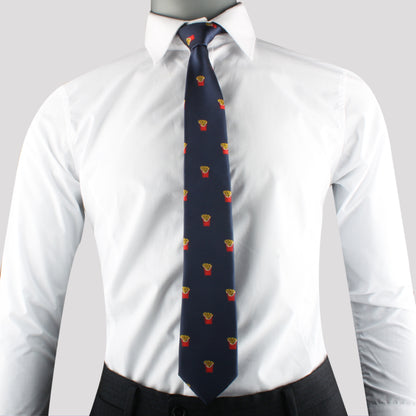 A person wearing a white dress shirt, the Fries Skinny Tie with small embroidered patterns in red and yellow, and dark gray trousers exudes modern sophistication.