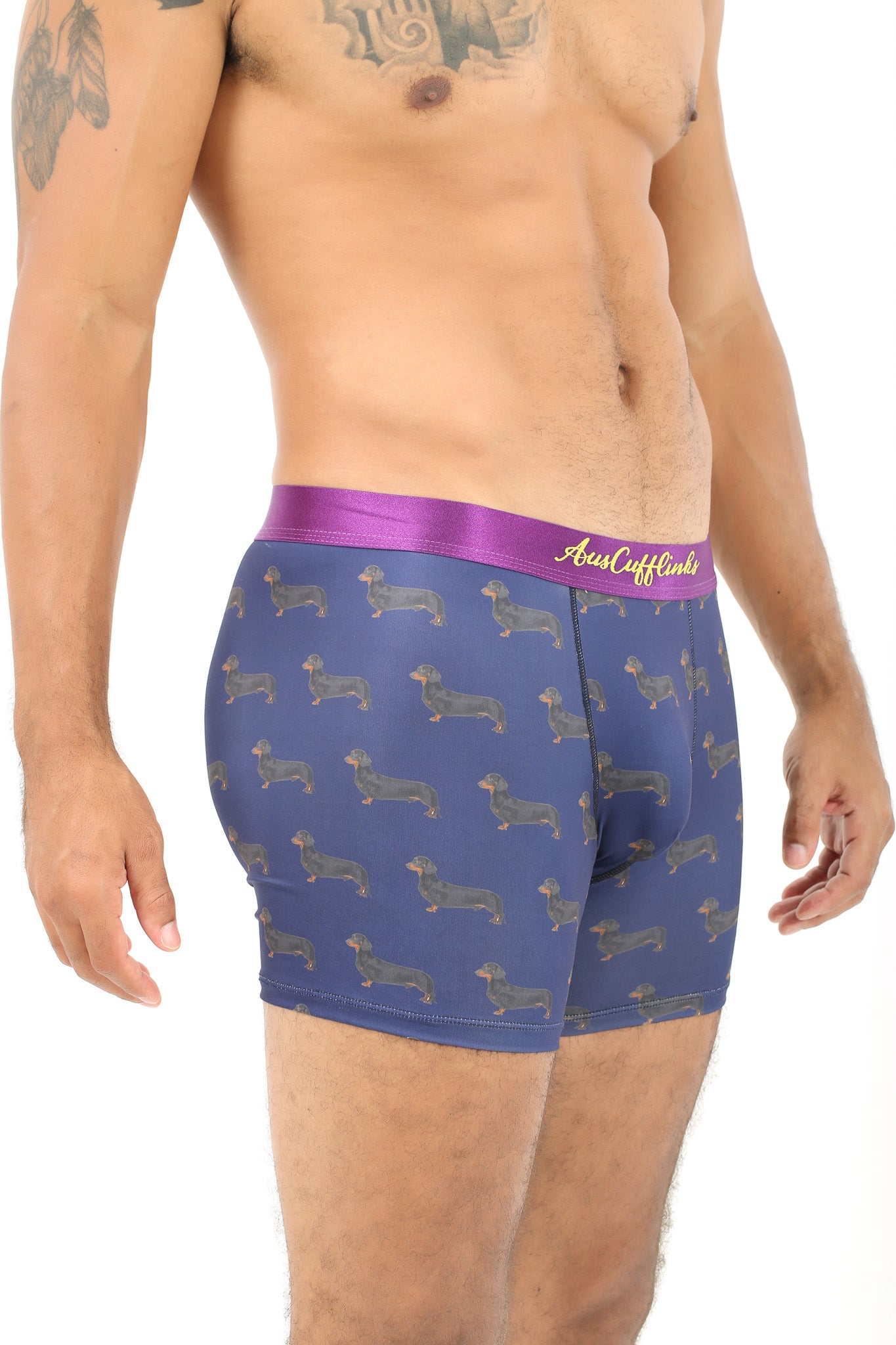 A man wearing a long comfort Sausage Dog Underwear with dachshunds on it.