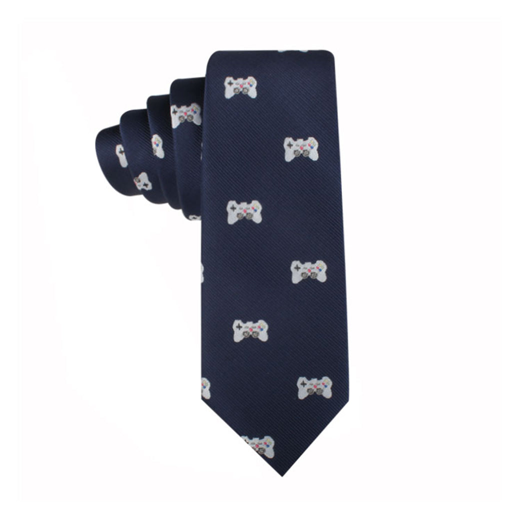 A navy blue Game Controller Skinny Tie with repeating patterns of white video game controllers, perfect for trendsetters and gamers who want to add a touch of style to their wardrobe.