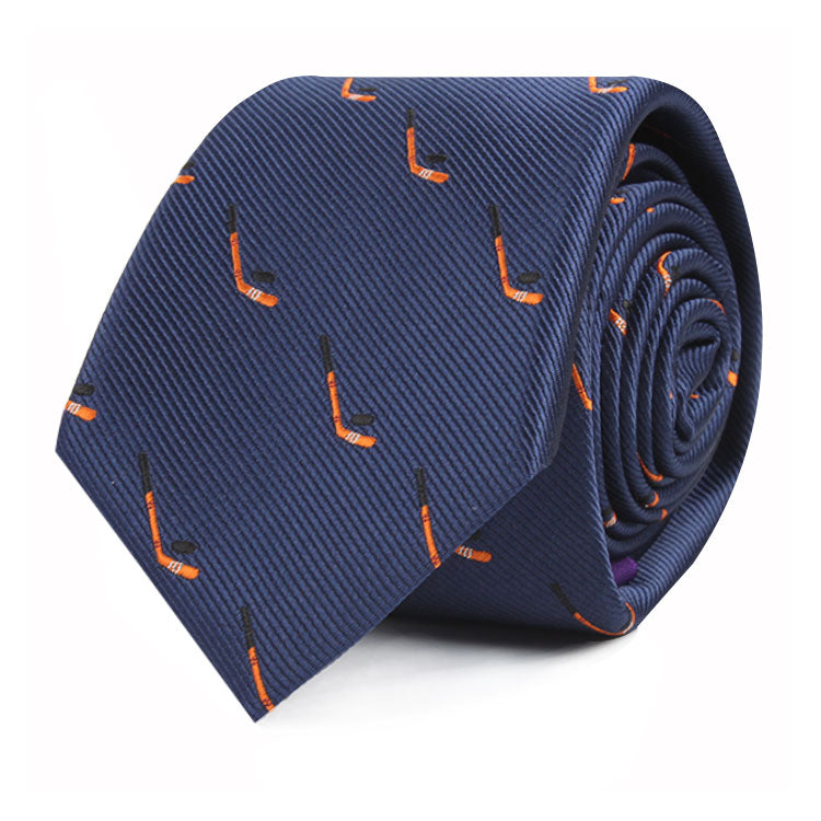 A blue Ice Hockey Skinny Tie with a pattern of small orange and black ice hockey sticks, capturing the timeless allure of sporting fervor.