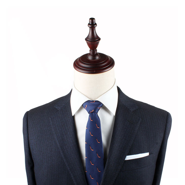 Mannequin dressed in a dark suit with a white shirt, Ice Hockey Skinny Tie, and a white pocket square, exuding timeless allure.