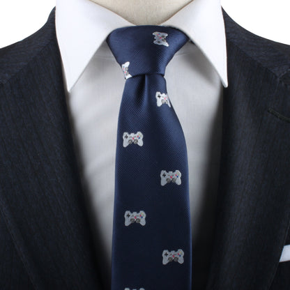 A close-up view of a person wearing a dark suit and white dress shirt with a Game Controller Skinny Tie, perfect for gamers who are also trendsetters.