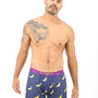 A man strikes a pose in the luxurious Banana Underwear against a plain white background.