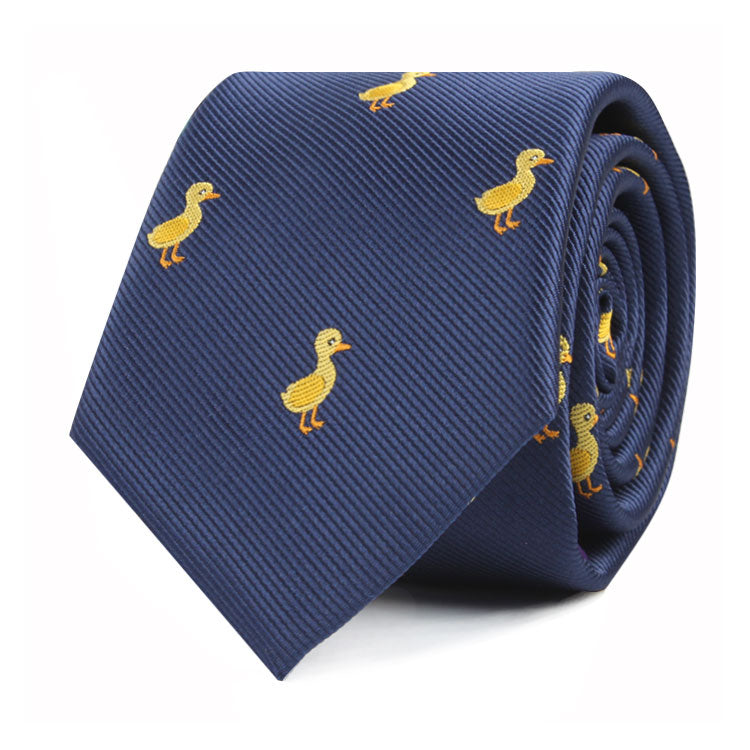 A Duck Skinny Tie featuring a pattern of small, embroidered yellow ducks adds a touch of cuteness to your style.