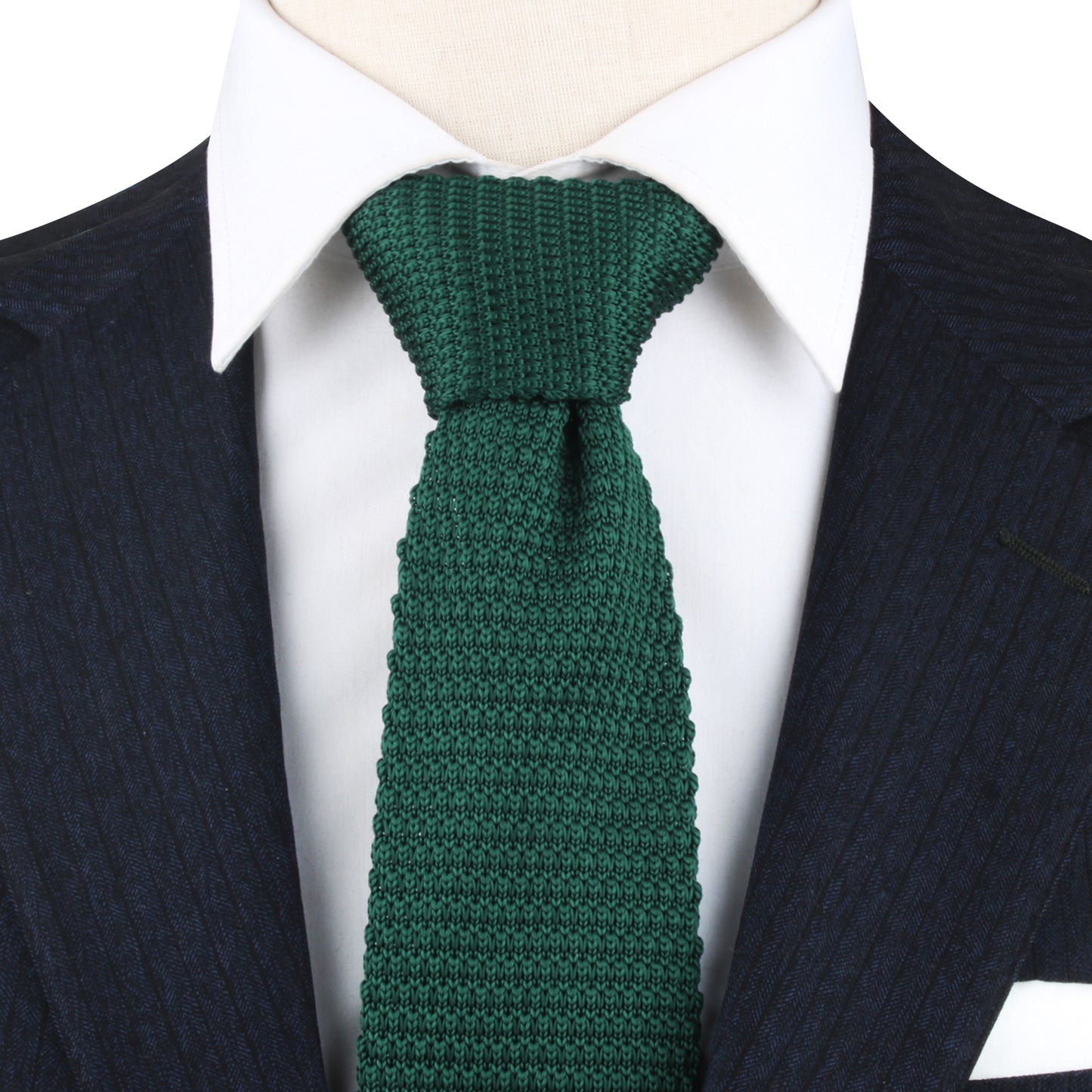 A navy pinstripe suit paired with a white shirt and the Green Knitted Skinny Tie exudes timeless elegance, offering a refreshing twist on classic style.