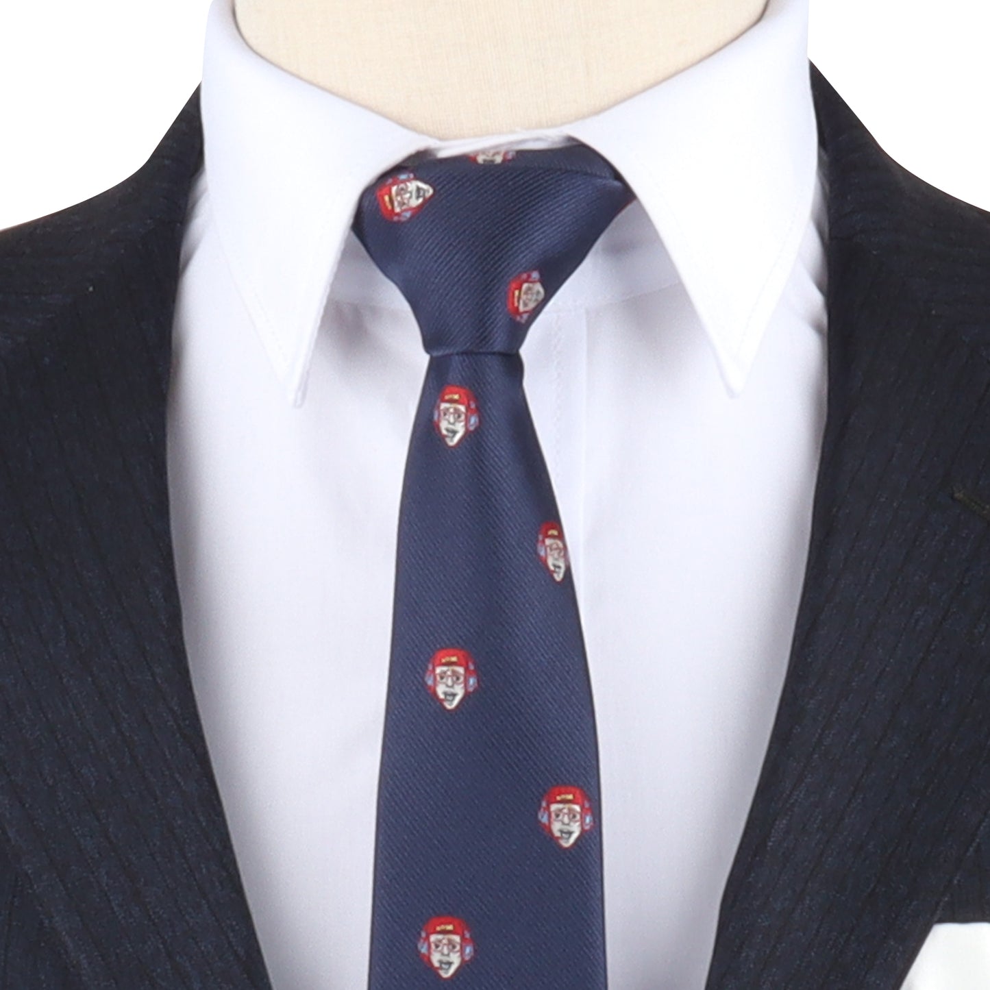 A mannequin effortlessly dons a dark suit, white shirt, and the "Gamer Face Skinny Tie," featuring a repetitive pattern of a man's face and red cap—leveling up its fashion game with subtle sophistication.