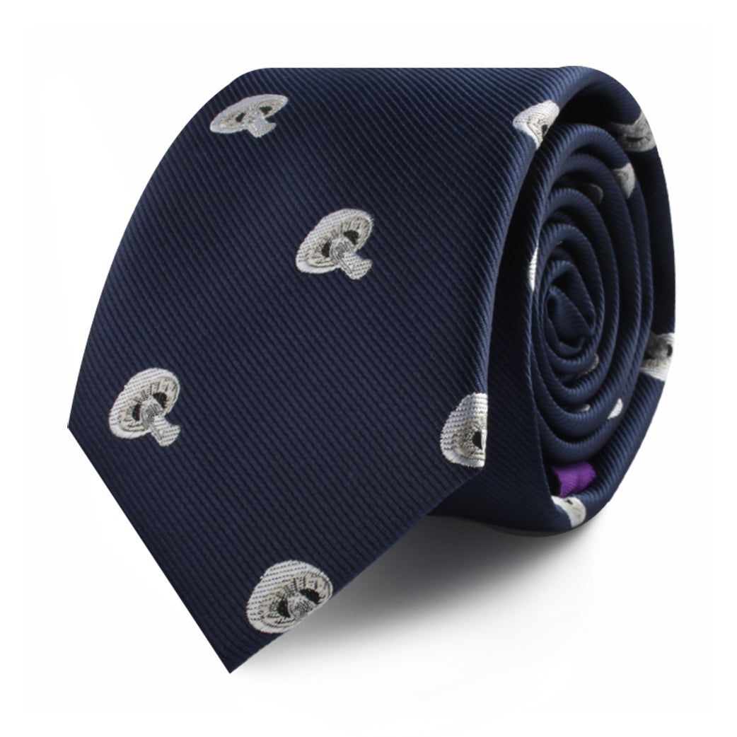 Mushrooms Skinny Tie in navy blue, adorned with nature-inspired white embroidered patterns, elegantly rolled up on a white background.