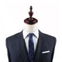 Mannequin dressed in a dark suit, white shirt, and the stylish Ten Pin Bowling Skinny Tie, with a wooden top fixture, exuding effortless style.