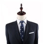 A mannequin dressed in a dark suit jacket, white shirt, and the Mushrooms Skinny Tie exudes elegance against the plain white background.