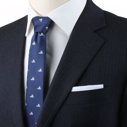 Navy blue suit with a white shirt and a Swimming Skinny Tie, embodying timeless style.