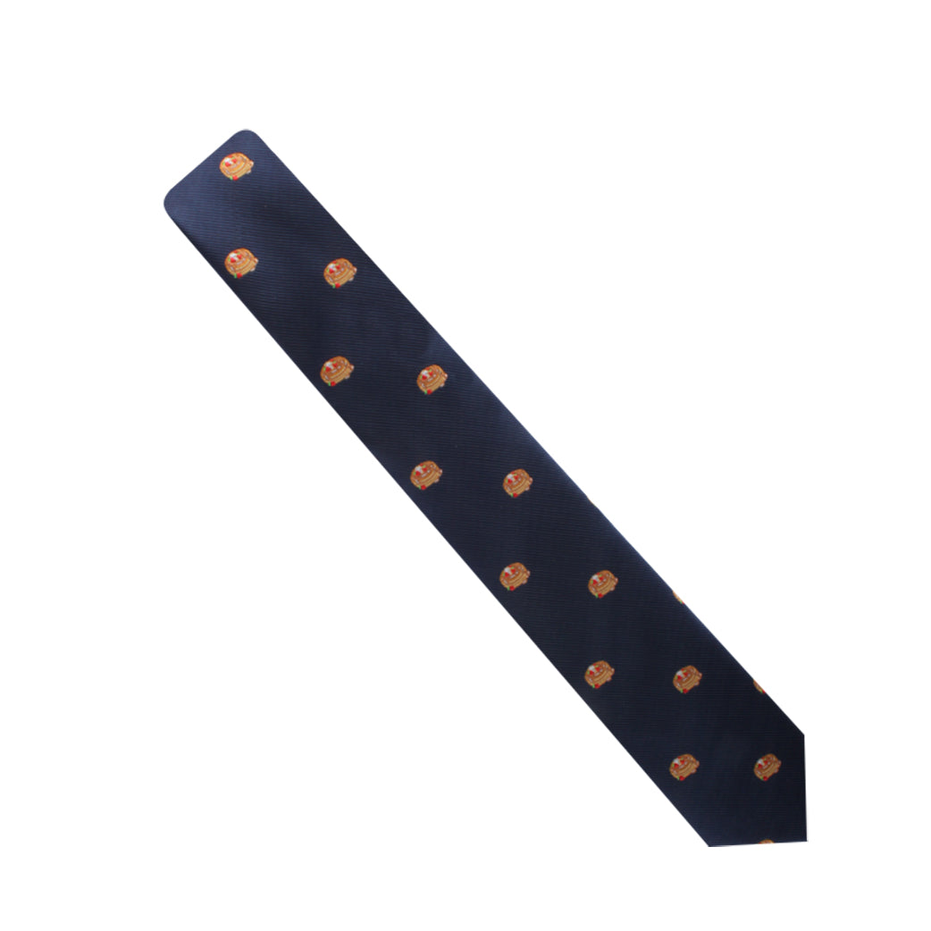 Navy blue Pancakes Skinny Tie with repeating orange emblem pattern on a white background.