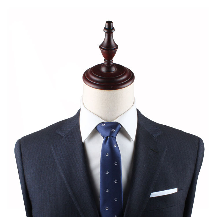 A suit and Anchor Skinny Tie anchored on a mannequin dummy.