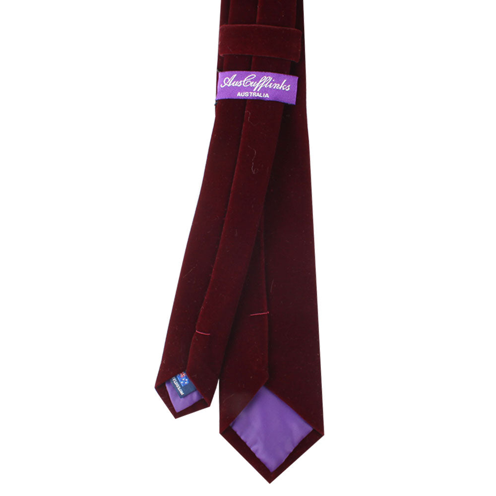 A Maroon Velvet Skinny Tie with rich tones features a plush purple inner lining and a label that reads "AusteriWorks, Australia.