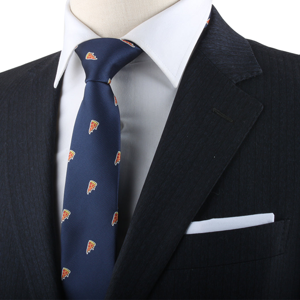 Close-up of a person wearing a dark suit and white shirt, with a Pizza Skinny Tie featuring pizza slice patterns, exuding an essential, savory style.