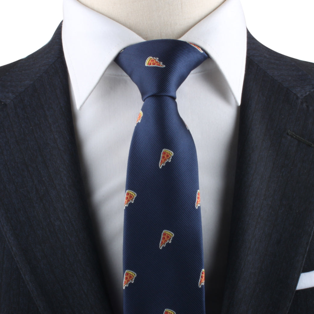 A person donning a dark blue suit with a white dress shirt and a Pizza Skinny Tie, showcasing essential savory style.