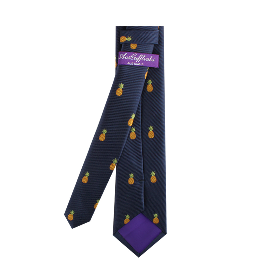 A Pineapple Skinny Tie exudes a tropical allure, complemented by a purple label that reads "Australian" attached to the back, blending modern elegance seamlessly.