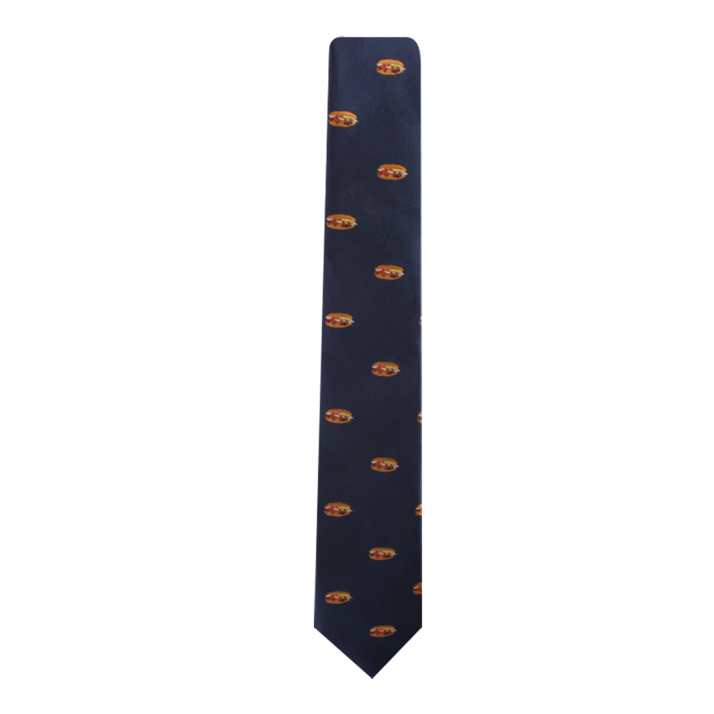 The Pork Roll Skinny Tie, featuring a navy blue background with a repeating pattern of small, multicolored burgers, adds modern charm by blending sophistication with a touch of comfort food nostalgia.