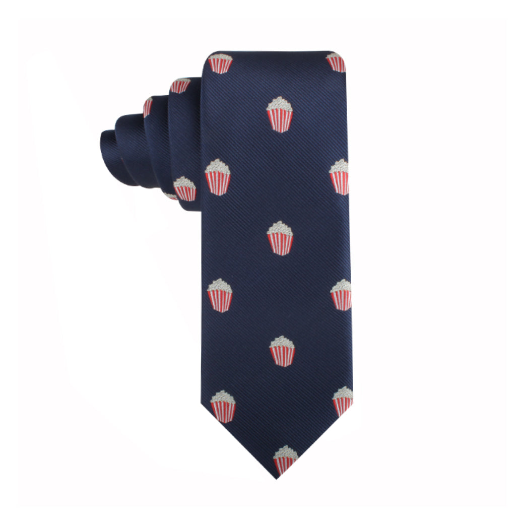 A Popcorn Skinny Tie, featuring a navy blue pattern of small popcorn containers in red and white, perfect for making a cinematic style statement.