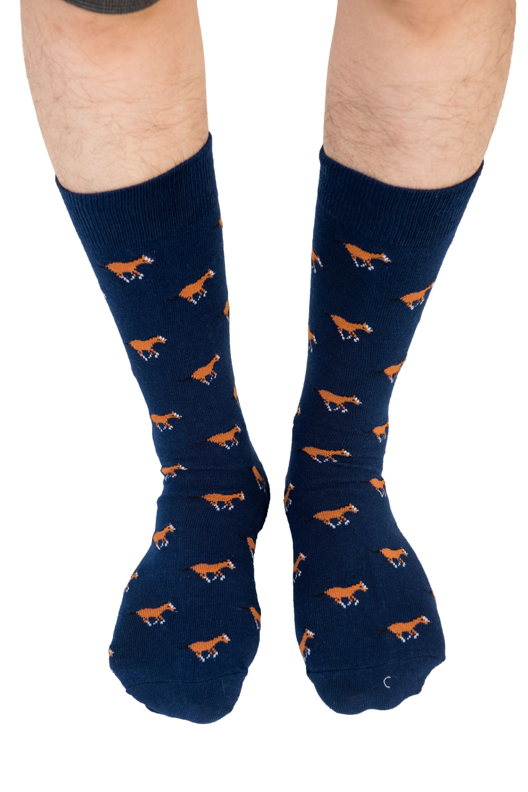 A man wearing Horse Socks with orange foxes.
