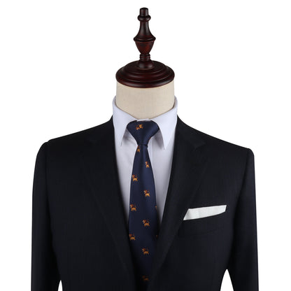 A mannequin dressed in a dark suit jacket, white dress shirt, and Lion Skinny Tie with a small pattern, exuding an air of authority as the leader in style. It has a white pocket square in the breast pocket.