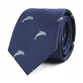 A Dolphin Skinny Tie features a design of small, light blue dolphins, perfect for ocean enthusiasts.