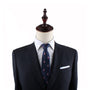 A tailor's mannequin dressed in a dark suit, white shirt, and the Soda Skinny Tie exudes a refreshing style with its chic wooden headpiece.