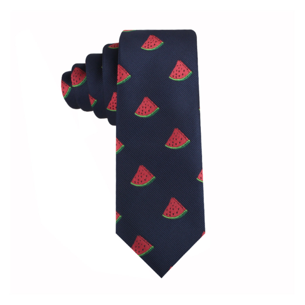 A navy blue necktie with a pattern of small, evenly spaced watermelon slices adds a touch of summertime freshness to your style with the Watermelon Skinny Tie.