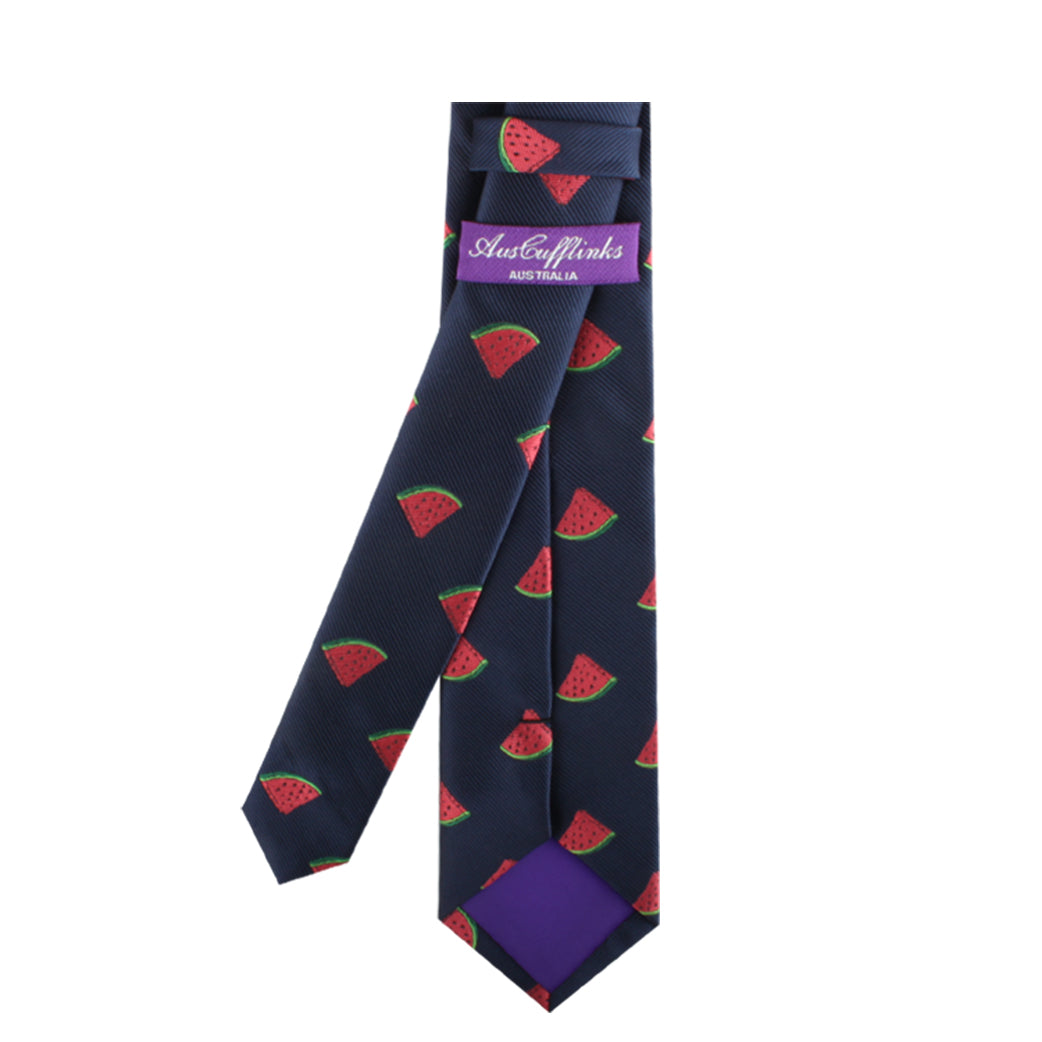 A Watermelon Skinny Tie with a pattern of red watermelon slices and a purple label that reads "AustCufflinks Australia," perfect for adding a touch of summertime freshness to your style.