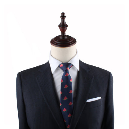 A mannequin dressed in a dark suit, white dress shirt, and a Watermelon Skinny Tie exudes timeless style and freshness.