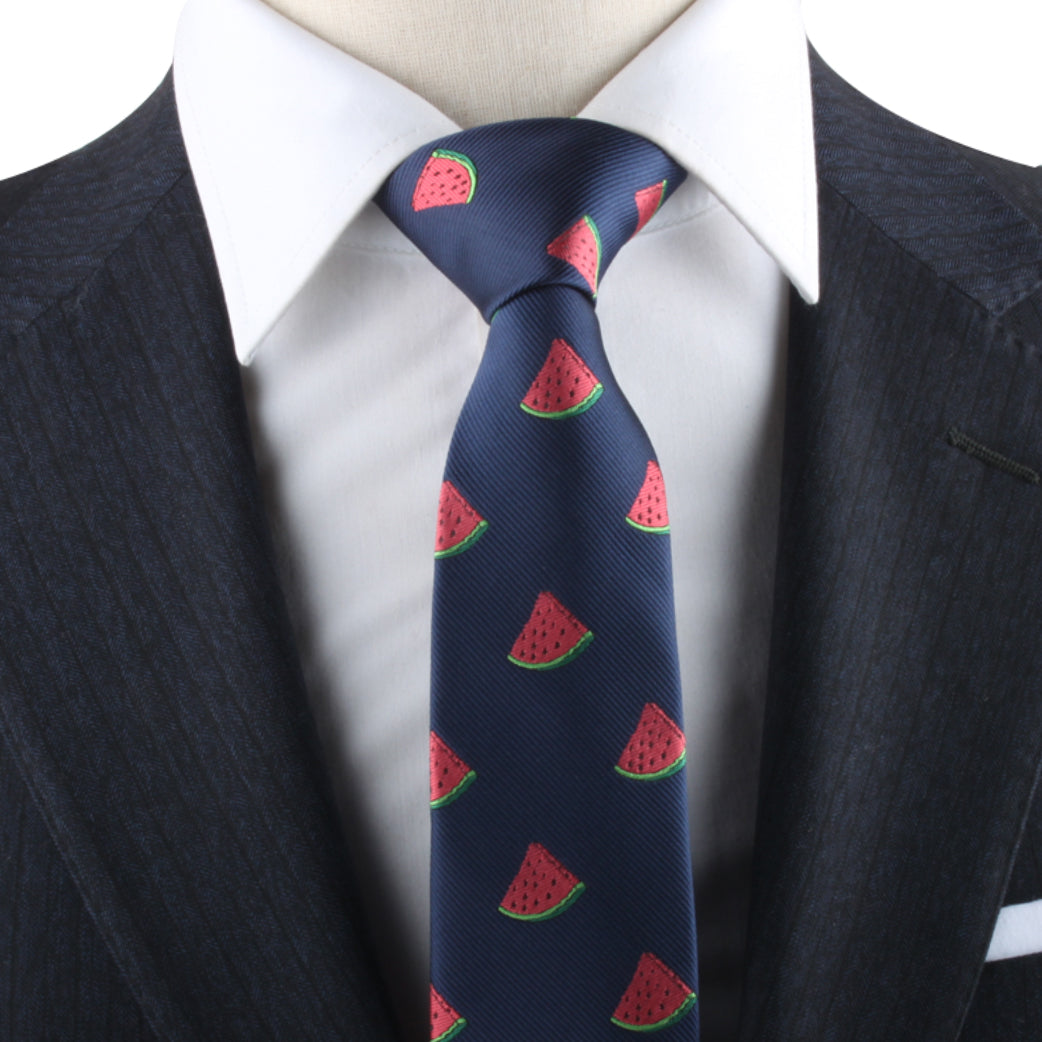 A person wearing a dark blue suit, a white dress shirt, and a Watermelon Skinny Tie exudes summertime freshness and style.