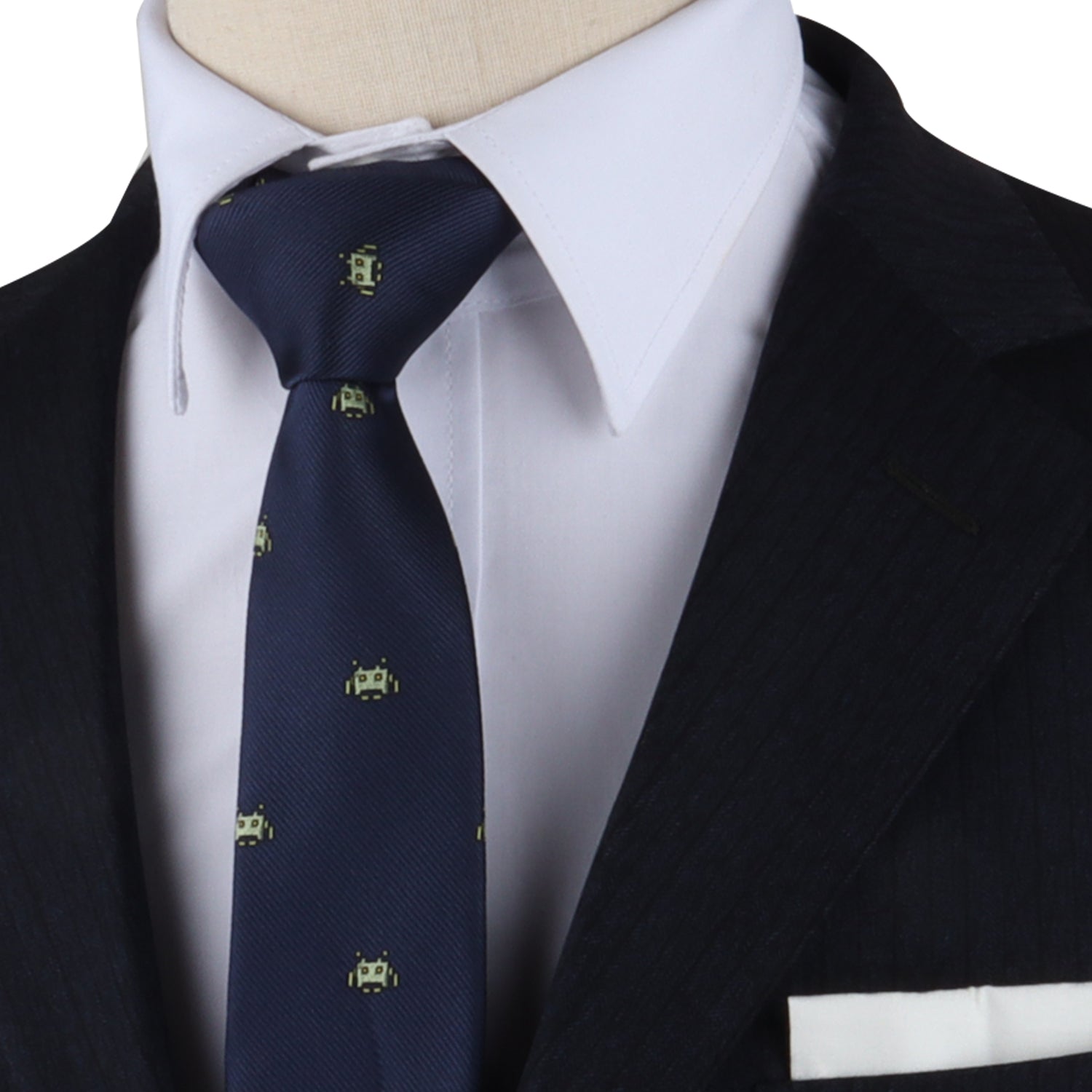 A mannequin in a suit with a Green Space Invader Skinny Tie and pocket square.