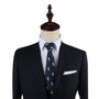 Mannequin wearing a dark suit, white dress shirt, and the Tequila Skinny Tie with a white pocket square—an ensemble that exudes zest and dapper design.