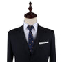 Mannequin dressed in a dark suit with a white shirt and the Tiger Skinny Tie, embodying a bold fashion statement.