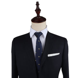 A stylish black suit on a mannequin dummy with a Bee Skinny Tie.