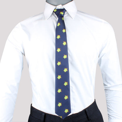 A mannequin wearing a white dress shirt and Green Turtle skinny tie with yellow floral patterns, exemplifying modern style.